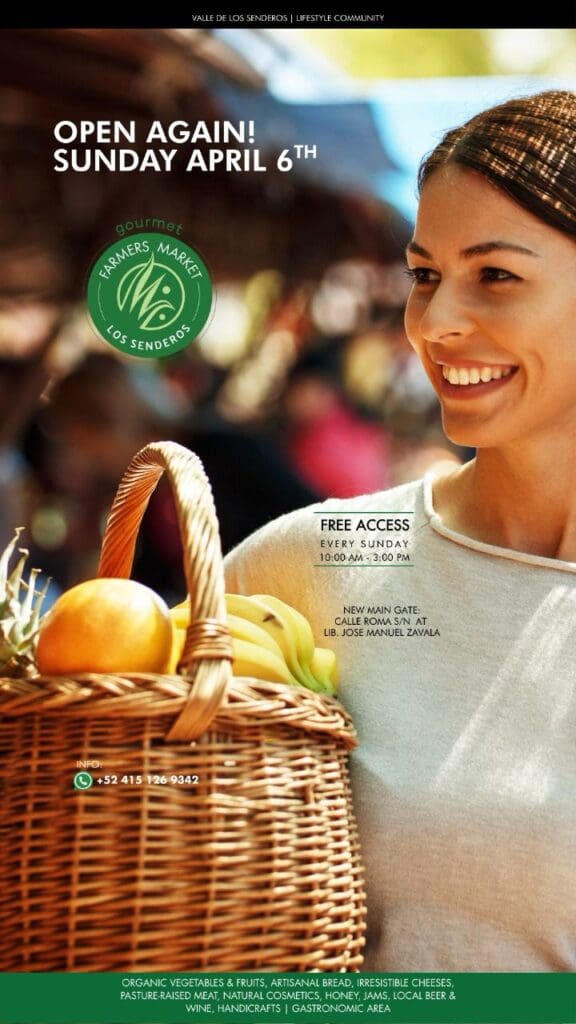 A woman holding a basket of fruit in front of her face.