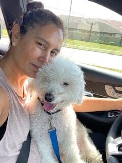 IMG_2792 A woman and her dog in the car.